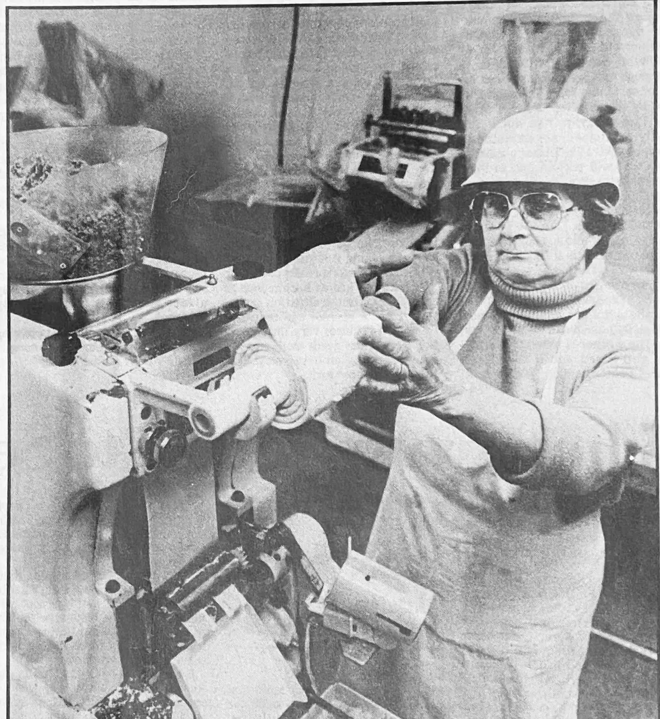 Flora Mascio feeds dough into a ravioli machine.